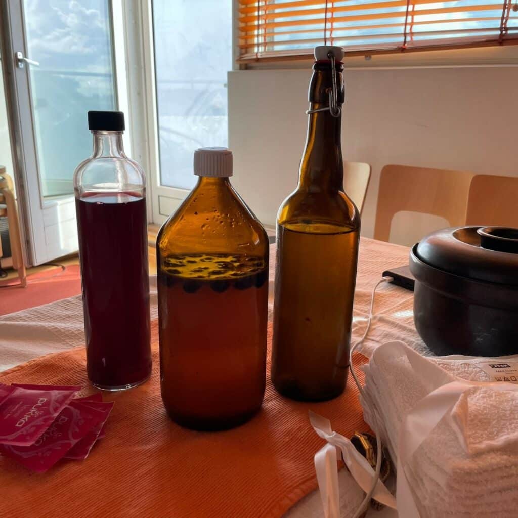 bottles, tea bags, and towels on a table
